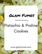 A promotional image featuring Pistachio & Praline Cookies perfume and body oil with the brand name 'Glam Fumes' displayed prominently. The cookies appear to be green with pistachio nuts and praline pieces visible.
